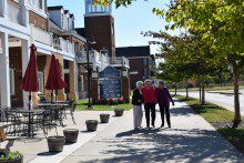Commercial-shoot-026R-220x147 three women standing on the sidewalk of a building